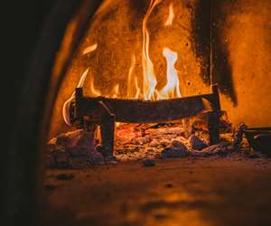 logs burning in an oven