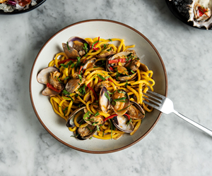 Saffron Bucatini with Manila Clams, seasonal